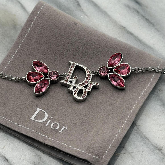 Jewelry - CHRISTIAN DIOR PINK CRYSTAL LOGO BUTTERFLY BRACELET
